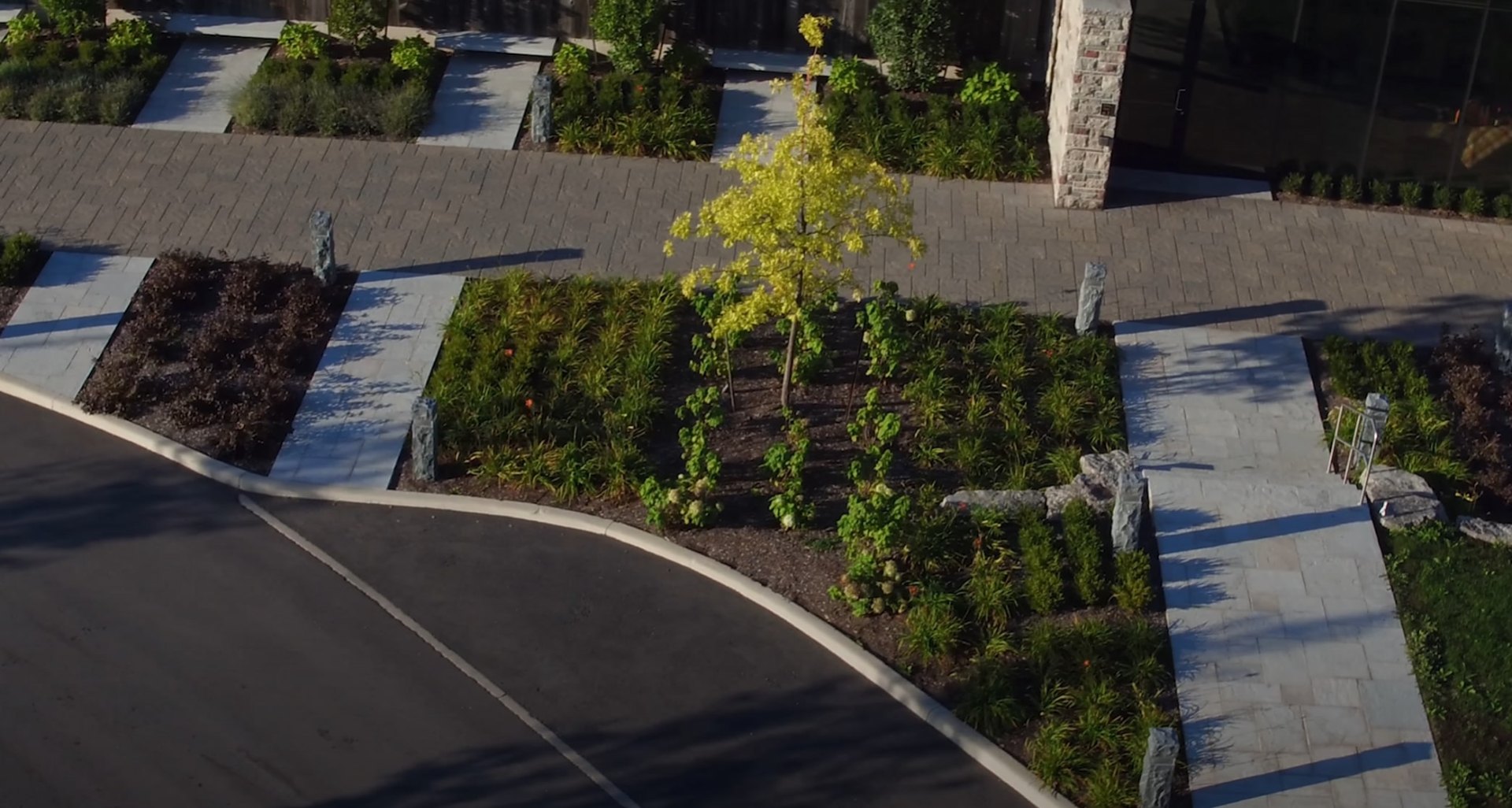 Aerial view of modern landscape design with geometric patterns and professional installation
