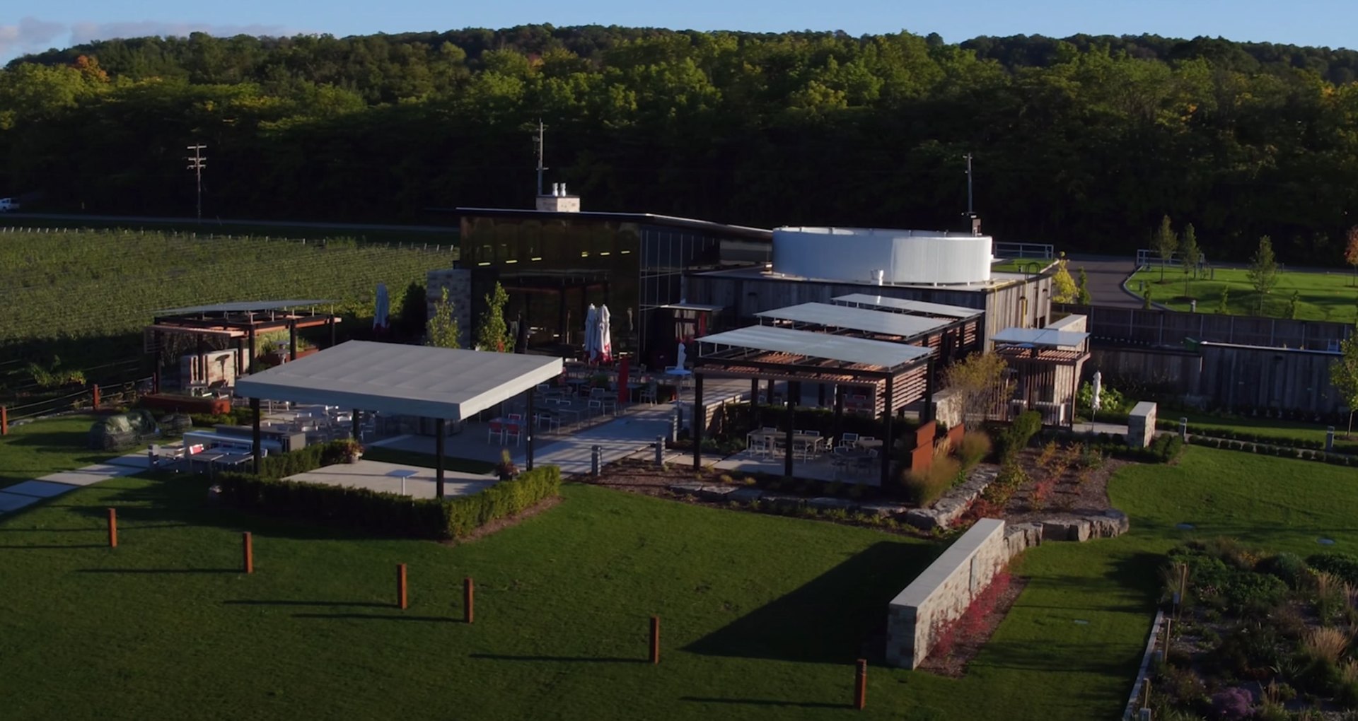 Large-scale commercial landscaping project with outdoor venue and modern architecture