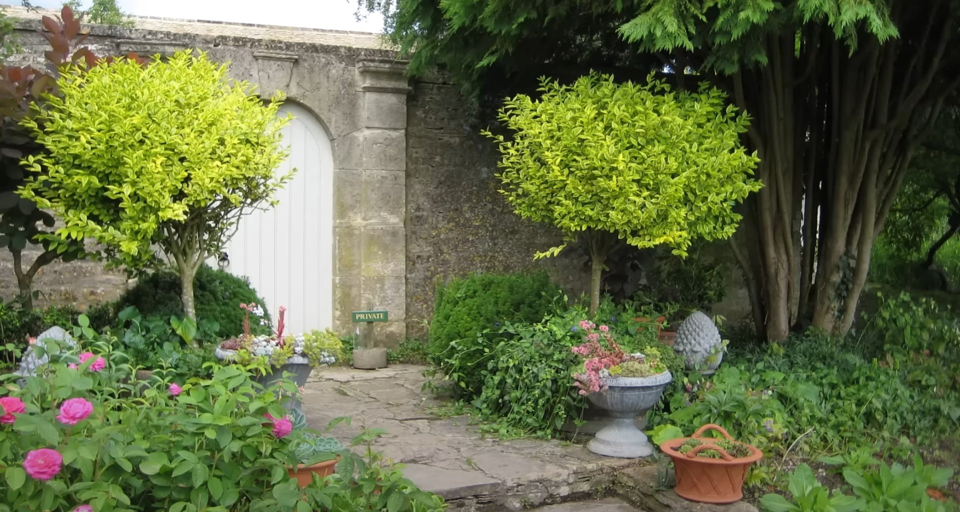 Beautiful garden design with stone archway